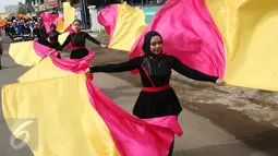 Peserta Pengibar Bendera mengikuti Kirab Kebangsaan 'Bersatu Kita Teguh', Subang, Jawa Barat, Sabtu (4/3). Kirab Kebangsaan ini bertujuan untuk menggelorakan semangat kebinekaan, persatuan dan Pancasila sebagai ideologi bangsa. (Liputan6.com/Johan Tallo)