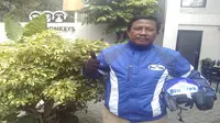 Bagi Ahmad, penghasilan sebagai sopir taksi Blue Bird dengan rider Blu-Jek tidak akan jauh berbeda. (Corry Anestia/Liputan6.com)