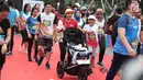 Ekspresi sejumlah pelari saat mencapai garis finis Jakarta Marathon 2018 di Gelora Bung Karno, Jakarta, Minggu (28/10). 12.500 pelari meramaikan Jakarta Marathon 2018 yang di sponsori PLN. (Liputan6.com/Faizal Fanani)