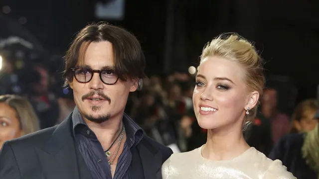 Johnny Depp dan Amber Heard.  (AP Photo/Joel Ryan, File)