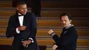 Striker PSG, Kylian Mbappe berjoget bersama DJ Prancis, Martin Solveig Mbappe setelah menerima penghargaan Trophee Kopa pada seremoni Ballon d'Or 2018 di Grand Palais, Senin (3/12). (FRANCK FIFE/AFP)