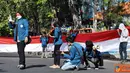 Citizen6, Surabaya: Aksi yang di pimpin koordinator aksi Dani Samuel ini mengambil Angka 54 yang merupakan simbol nasionalisasi Unair tahun 1954. (Pengirim: Nias Stovit)