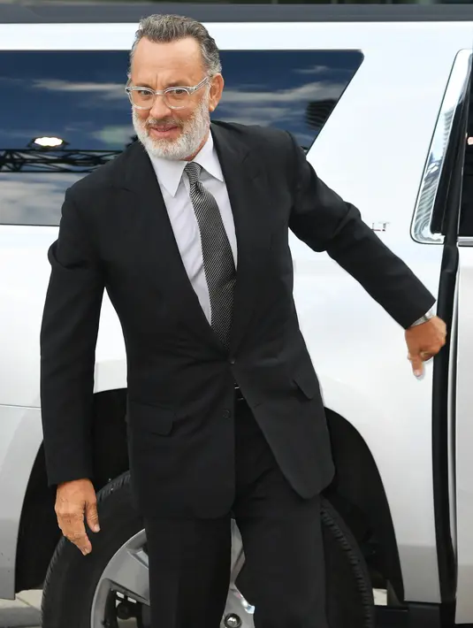 Tom Hanks menghadiri pemutaran perdana "A Beautiful Day In The Neighborhood" selama Festival Film Internasional Toronto 2019 di Toronto, Kanada 7 September 2019. Tom Hanks dan istrinya Rita Wilson dinyatakan positif virus corona. (Kevin Winter/Getty Images for TIFF/AFP)