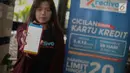 Seorang pengguna menunjukan aplikasi Kredivo dalam acara peluncuran Kredivo produk pinjaman tunai di Jakarta, Selasa (4/12). Kredivo merupakan pinjaman digital yang dikhususkan untuk kaum millenial. (Liputan6.com/Faizal Fanani)