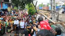 Pasangan Capres Cawapres Joko Widodo (Jokowi)-Ma'ruf Amin menyampaikan pidato kemenangannya di Kampung Deret, Tanah Tinggi, Jakarta, Selasa (21/5/2019). Pidato tersebut menanggapi keputusan KPU yang menetapkan pasangan Jokowi-Ma'ruf Amin sebagai pemenang Pilpres 2019. (Liputan6.com/Angga Yuniar)