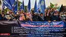 Ada 23 tuntutan utama yang disuarakan para buruh di Surabaya. (Juni KRISWANTO/AFP)