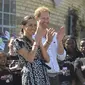 Meghan Markle dan Pangeran Harry dalam lawatan ke Afrika  (Courtney Africa / Africa News Agency via AP, Pool)