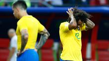 Bek Brasil, Marcelo bereaksi terhadap kekalahan timnya dari Belgia pada laga perempat final Piala Dunia 2018 di Stadion Kazan Arena, Jumat (6/7). Timnas Brasil takluk 1-2 di tangan timnas Belgia. (BENJAMIN CREMEL/AFP)