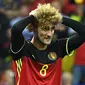 1. Marouane Fellaini (Belgia), gelandang kribo asal klub Manchester United ini tampil dengan rambut yang diwarnai pirang pada ajang Piala Eropa 2016. (AFP/Emmanuel Dunand) 