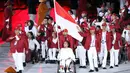 Atlet Para Games Indonesia melakukan defile saat pembukaan Asian Para Games 2018 di Stadion Utama Gelora Bung Karno, Jakarta, Sabtu (6/10). Asian Para Games 2018 berlangsung 6-13 Oktober. (Liputan6.com/Helmi Fithriansyah)