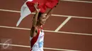 Atlet Indonesia, Rini Budiarti melakukan selebrasi usai finish pertama lari halang rintang 3.000 meter SEA Games ke-28 di National Stadium, Singapura, (12/6/2015). Rini mencatat waktu 10 menit 20,40 detik. (Liputan6.com/Helmi Fithriansyah)