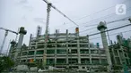 Suasana proyek pembangunan Jakarta International Stadium atau Stadion BMW di kawasan Papanggo, Tanjung Priok, Jakarta, Senin (18/1/2021). Progres pembangunan stadion berkapasitas 82 ribu penonton tersebut telah mencapai 43,7 persen. (Liputan6.com/Faizal Fanani)