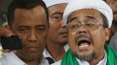 Jaringan Intelektual Muda Anti Fitnah melaporkan pimpinan FPI  Rizieq Shihab ke Polda Metro. terkait pernyataan lambang palu di uang kertas 