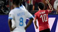 Winger Timnas Mesir, Mohamed Salah, berhasil mencetak satu gol sekaligus membantu timnya menang 2-0 atas Kongo pada laga kedua Grup A Piala Afrika 2019, Rabu (26/6/2019). (AFP/Javier Soriano)