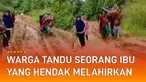 Seorang ibu harus ditandu warga melewati jalan berlumpur karena mobil ambulans tidak bisa melintasi jalan tersebut.