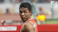 Pelari cepat Indonesia, Lalu Muhammad Zohri usai kualifikasi lari 100 meter Asian Games 2018 di Stadion GBK, Jakarta, Sabtu (25/8/2018). Lalu M Zohri mencatat waktu 10,27 detik dan berhak tampil di semifinal. (Liputan6.com/Helmi Fithriansyah)