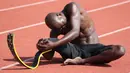 Atlet Prancis Jean Baptiste Alaize, yang mewakili Prancis pada Paralympic Games 2016 di Rio, memakai tungkai prothesis di bawah lutut selama sesi latihan di Antibes, Prancis selatan pada 24 Agustus 2020. (AFP Photo/Valery Hache)