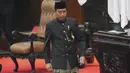 Kali ini, Jokowi tampil lebih simpel dengan baju adat Betawi ujung serong dibanding sederet edisi terdahulu yang memperlihatkan ragam aksesori rumit. (AP Photo/Tatan Syuflana, Pool)