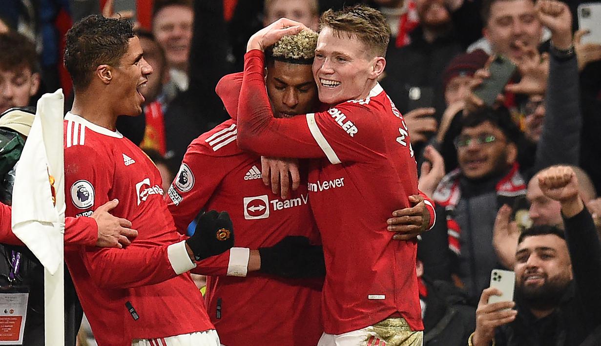 Gol tunggal Marcus Rashford di injury time memastikan kemenangan dramatis 1-0 Manchester United atas West Ham United dalam laga lanjutan Liga Inggris di Old Trafford Stadium, Sabtu (22/1/2022). Dengan hasil ini Setan Merah naik ke posisi 4 klasemen sementara. (AFP/Oli Scarff)