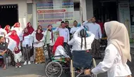 Dari Kursi Roda, Pengibar Bendera Kibarkan Merah Putih di Kudus