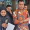 Kuasa hukum korban kasus dugaan penipuan dan penggelapan dengan modus pemalsuan QRIS yang menimpa Toko The Exclusive Tailor Medan tengah menyampaikan keterangan pers. (Liputan6/Reza Efendi)
