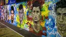Lukisan wajah pemain top dunia mejeng di salah satu sudut kota Rio de Janeiro, Brasil, Rabu (21/05/2014) (AFP PHOTO/Yasuyoshi CHIBA).