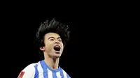 Eskpresi pemain Brighton, Kaoru Mitoma, setelah membobol gawang Chelsea dalam lanjutan Piala FA 2024/2025, Minggu (9/2/2025) dini hari WIB. (Gareth Fuller/PA via AP)