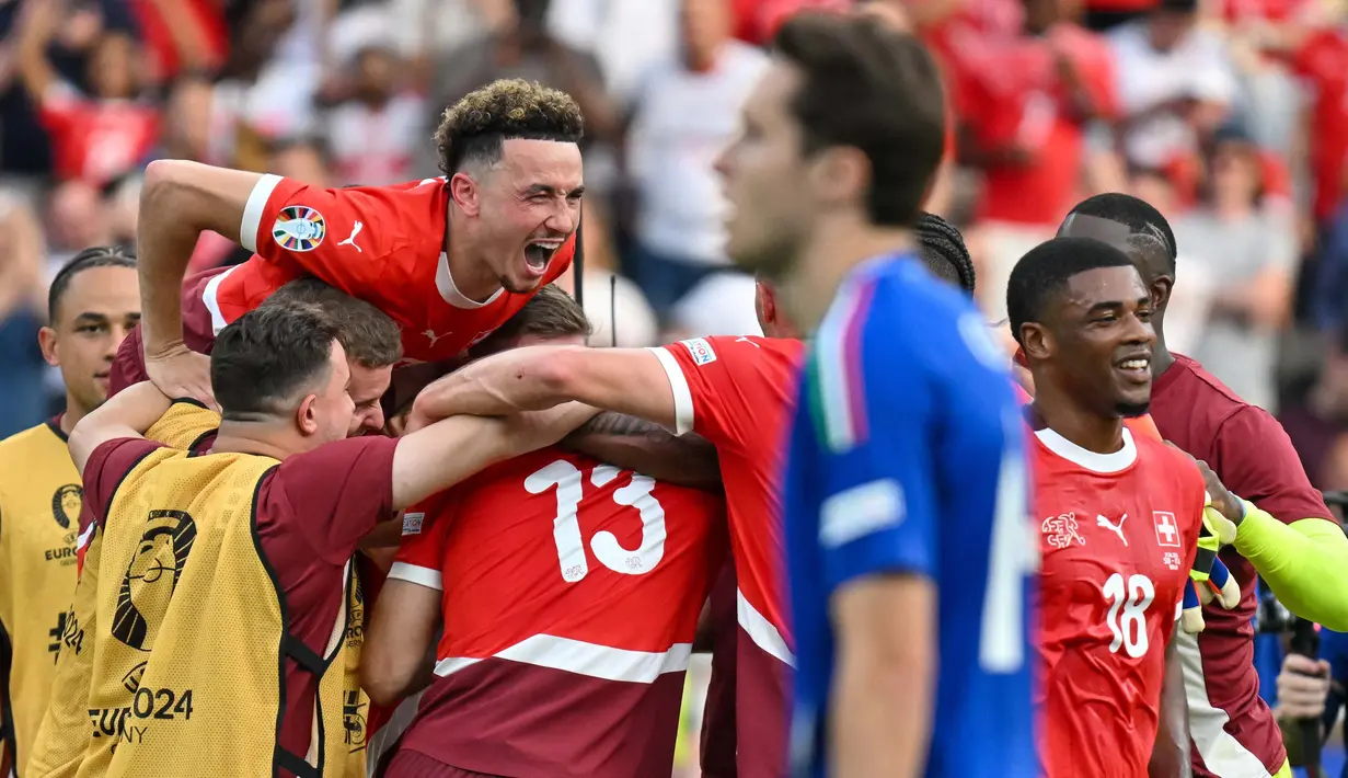 Berlaga di Olympiastadion Berlin, Swiss tampil agresif. (Fabrice COFFRINI/AFP)