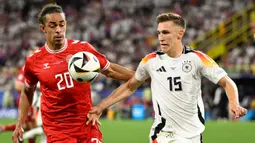 Berstatus tuan rumah, Jerman tampil agresif sejak awal laga. (INA FASSBENDER/AFP)