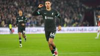 Pemain Liverpool, Trent Alexander-Arnold, merayakan gol keempat timnya dalam pertandingan Liga Primer Inggris antara West Ham United dan Liverpool di Stadion London, London, Senin dini hari WIB (30-12-2024). (Foto AP/Kirsty Wigglesworth)