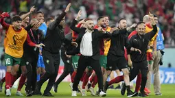 Dibalik keberhasilan pasukan Singa Atlas di Piala Dunia kali ini tak lepas dari peran sang pelatih yang bernama Walid Regragui. (AP/Martin Meissner)