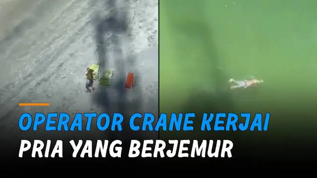 Seolah sedang tak bertugas, ia menjahili pengunjung pantai dengan crane.