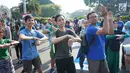 Peserta melakukan tarian Flashmob dalam kegiatan Pawai Tolak Plastik Sekali Pakai di Lapangan Aspirasi Monas, Jakarta, Minggu (21/7/2019). Pawai bebas plastik ini akan menjadi aksi terbesar di Indonesia untuk menolak penggunaan plastik sekali pakai. (Liputan6.com/Immanuel Antonius)