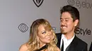 Penyanyi Mariah Carey dan kekasihnya, Bryan Tanaka menghadiri acara after party Golden Globes di California, Minggu (7/1). Kemesraan Mariah Carey dan pacar brondongnya tak pelak menjadi pemandangan yang sayang dilewatkan (Frazer Harrison/GETTY IMAGES/AFP)