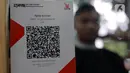 Dengan QRIS, pelanggan dapat membayar langsung menggunakan dompet digital yang terhubung dengan kode QR yang dihasilkan oleh pedagang atau penyedia jasa. (Liputan6.com/Johan Tallo)