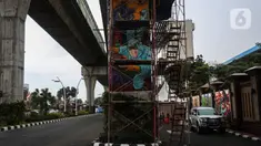 Mural terlihat di kawasan Lapangan Bhayangkara, Mabes Polri, Jakarta, selasa (2/11/2021). Selama ini seni mural kurang mendapatkan tempat di fasilitas-fasilitas umum dan Pembuatan Mural ini bagian dalam rangka Bhayangkara Mural Festival 2021. (Liputan6.com/Johan Tallo)