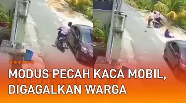 Aksi seorang pria memecahkan kaca mobil dan mencuri barang terjadi di pinggir jalan.