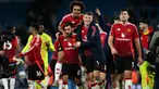 Pemain Manchester United, Bruno Fernandes (kedua kiri) bersama Joshua Zirkzee (tengah) dan Rasmus Hojlund (kedua kanan) melakukan selebrasi usai pertandingan sepak bola Liga Premier Inggris melawan Manchester City di Stadion Etihad, Manchester, Inggris, pada 15 Desember 2024. (Paul ELLIS/AFP)