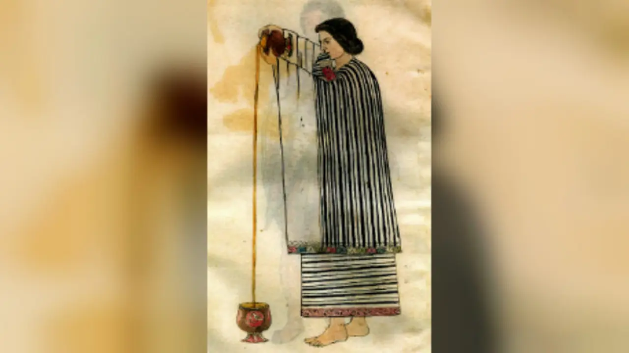 Seorang wanita kaum Aztec menghasilkan busa dengan menuangkan cokelat dari satu gelas ke gelas lain (Wikipedia/ Public Domain)