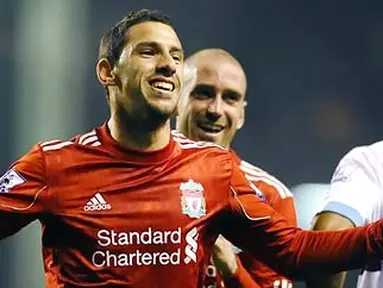 Winger Liverpool Maxi Rodriguez merayakan gol penutup kemenangan 3-0 atas West Ham yang dibukukan di Anfield pada lanjutan Liga Premier, 20 November 2010. AFP PHOTO/PAUL ELLIS