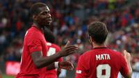 Paul Pogba merayakan gol Juan Mata ke gawang Kristiansund pada laga uji coba di Ullevaal Stadium, Selasa (30/7/2019) dini hari WIB. (Twitter ManUtd)