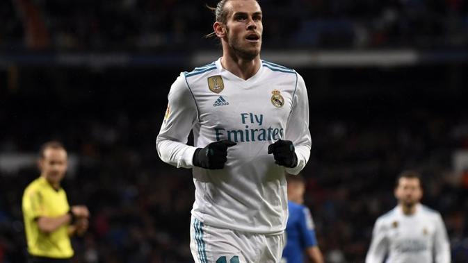 Gelandang Real Madrid, Gareth Bale, kabarnya tak memiliki niat untuk hengkang pada bursa transfer musim panas 2018 nanti. (AFP/PIERRE-PHILIPPE MARCOU)