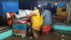 Satu persatu warga yang tinggal di bantaran sungai Sampean membawa barang berharga mereka.
