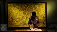 Lukisan karya Ida Bagus Made Nadera dengan judul Fadjar menjingsing di Galeri Nasional, Jakarta, Senin (1/8). Pameran ini berlangsung dalam rangka memeriahkan HUT Kemerdekaan RI ke-71. (Liputan6.com/Gempur M Surya)