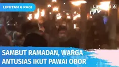 Ratusan warga antusias dan semangat ikuti pawai obor dengan berjalan kaki di Lubang Buaya, Cipayung. Peserta membawa obor sambil melantunkan ayat suci Al-Quran dengan iringan musik hadroh.