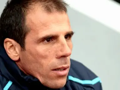 West Ham Manager Gianfranco Zola watches players warm up ahead of a Premiership match against Portsmouth at Boleyn Ground, London, on November 15, 2008. AFP PHOTO/Leon Neal