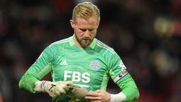 Meski Kasper Schmeichel memiliki andil yang sangat besar bagi Leicester City, namun hal tersebut seolah hilang pada musim ini. Mereka bahkan memiliki rekor pertahanan terburuk keenam dan menempati urutan ke-12 dalam tabel Liga Inggris sejauh ini. (AFP/Oli Scarff)