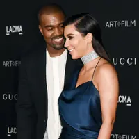 Cinta Kanye West untuk Kim Kardashian memang terlihat jelas. Keluarga mereka pun bisa dibilang harmonis. (REX/Shutterstock)