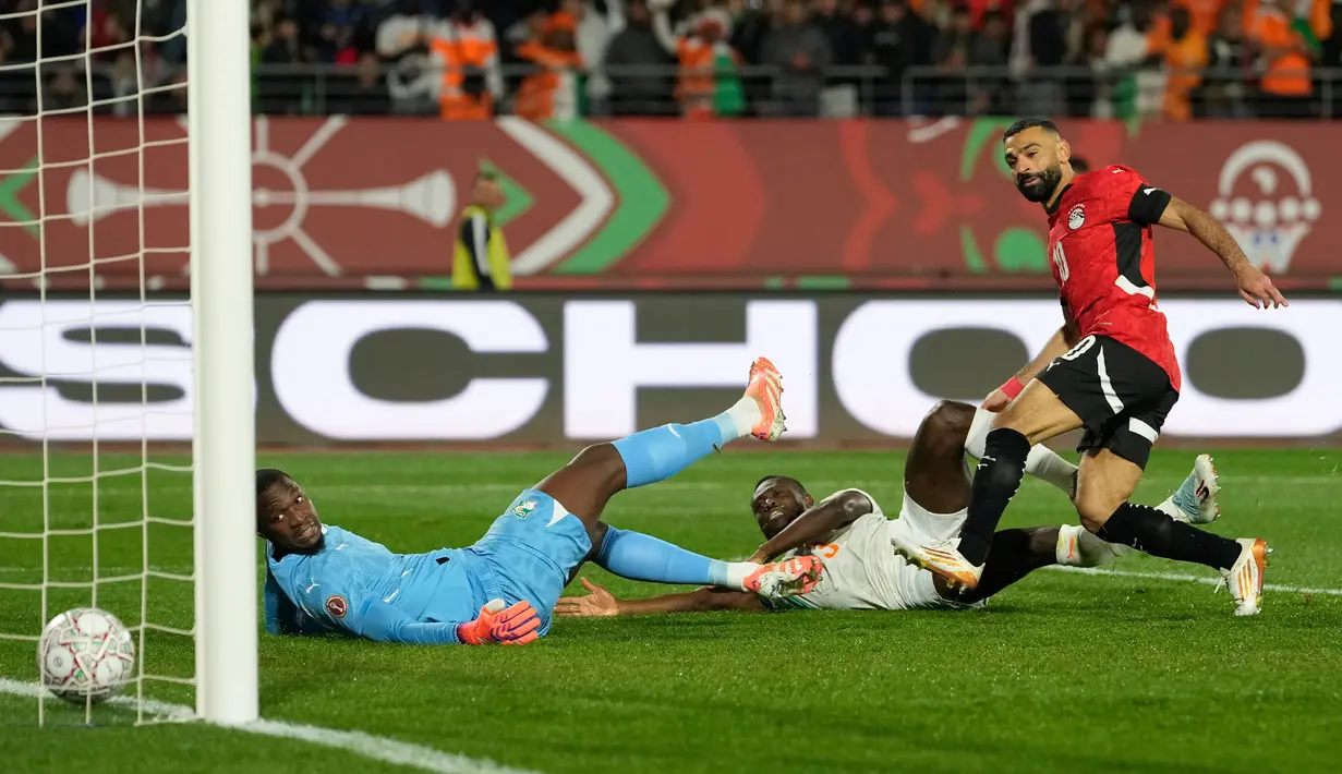 Kemenangan Mesir atas Pantai Gading pada laga perempat final Piala Afrika 2025, Sabtu (10/01/2026) waktu setempat, tak lepas dari peran Mohamed Salah. (AP Photo/Mosa'ab Elshamy)