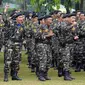 Anggota Banser NU meneriakkan yel yel jelang mengikuti Apel Kebangsaan di Perkemahan Ragunan, Jakarta, Selasa (18/4). Apel ini bertema Memperteguh Semangat Kebangsaan, Membawa Khazanah Islam untuk Perdamaian Dunia. (Liputan6.com/Helmi Fithriansyah)